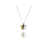 fragile heart necklace with green heart moissanite.