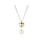 fragile heart necklace with green heart moissanite.