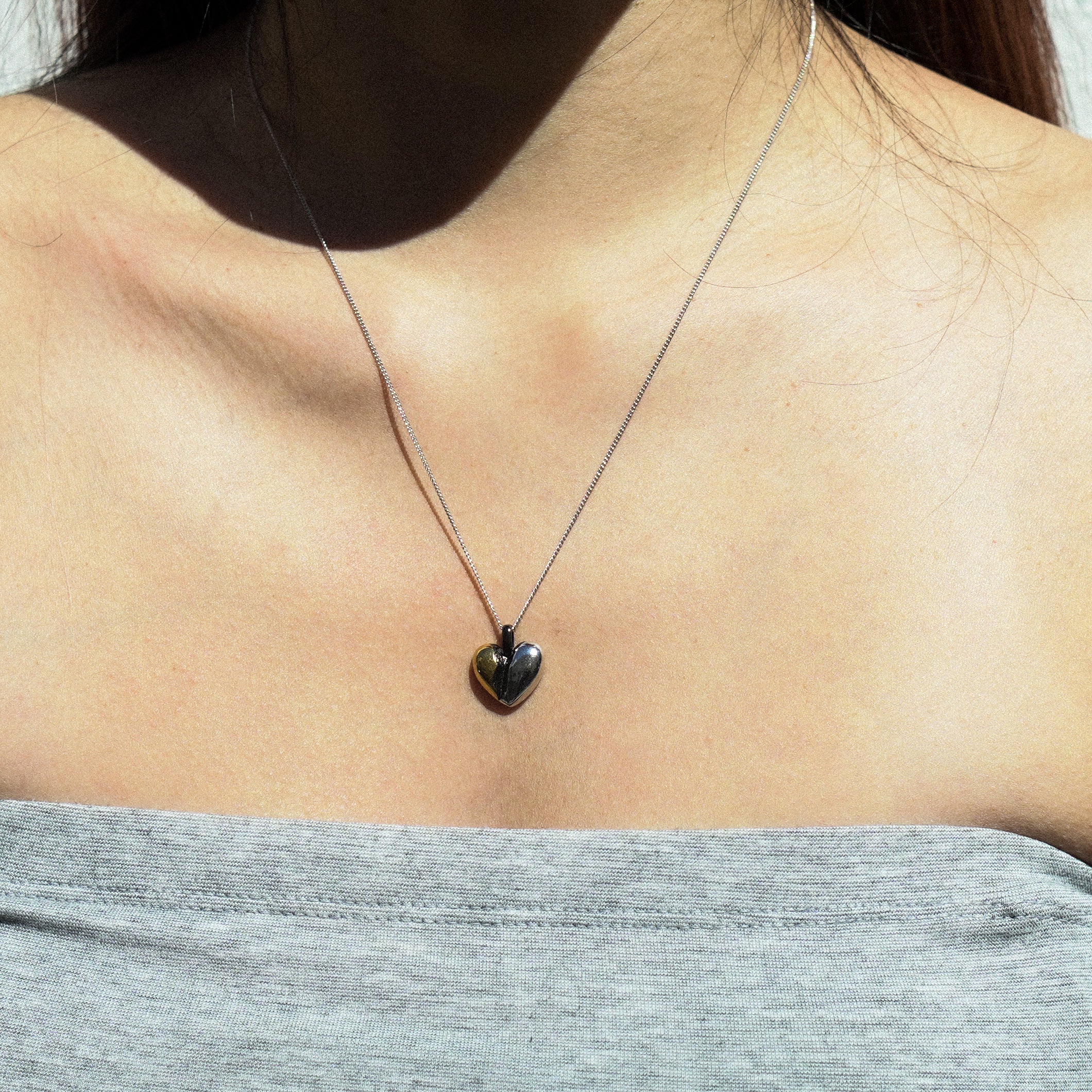 fragile heart necklace with green heart moissanite.
