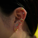 Bezel Pierce with Green Moissanite.