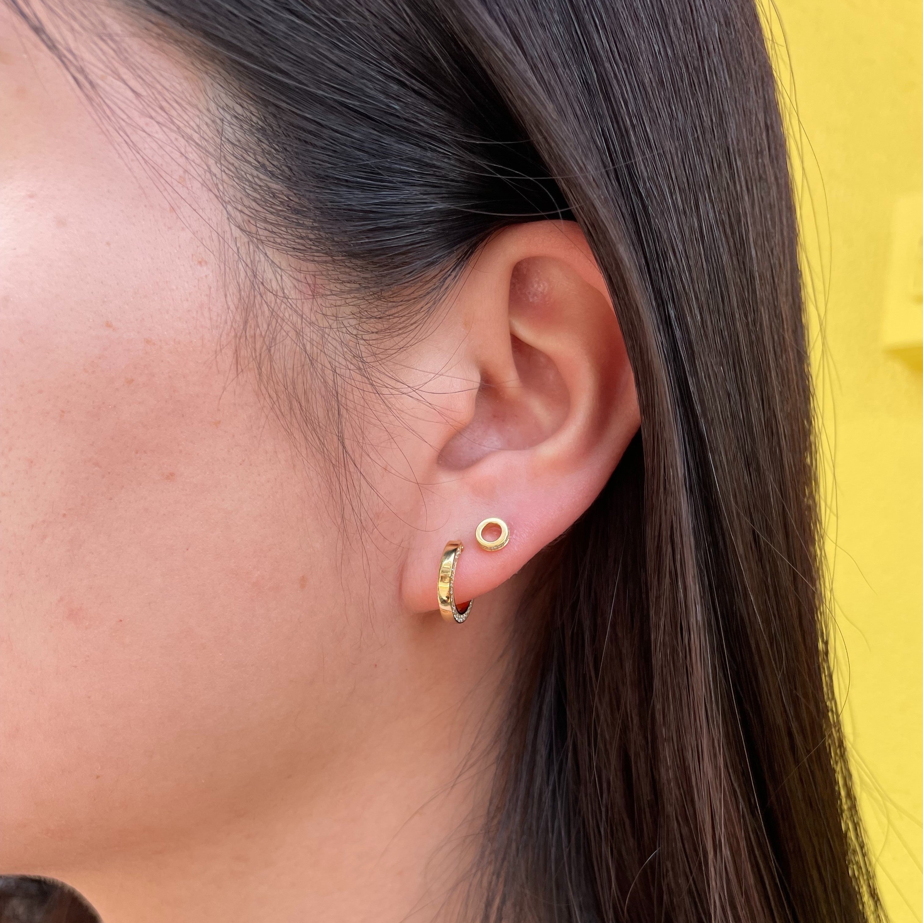Circle hole pop earring.