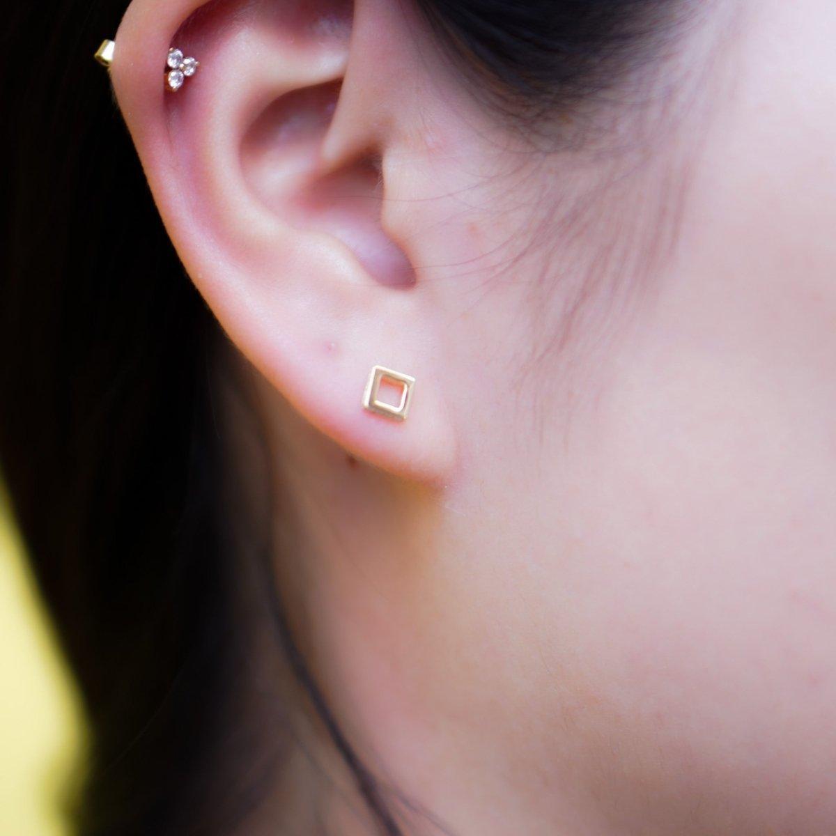 Square hole pop earring.