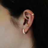 Three-Dimensional Enamel Hoop Earrings.